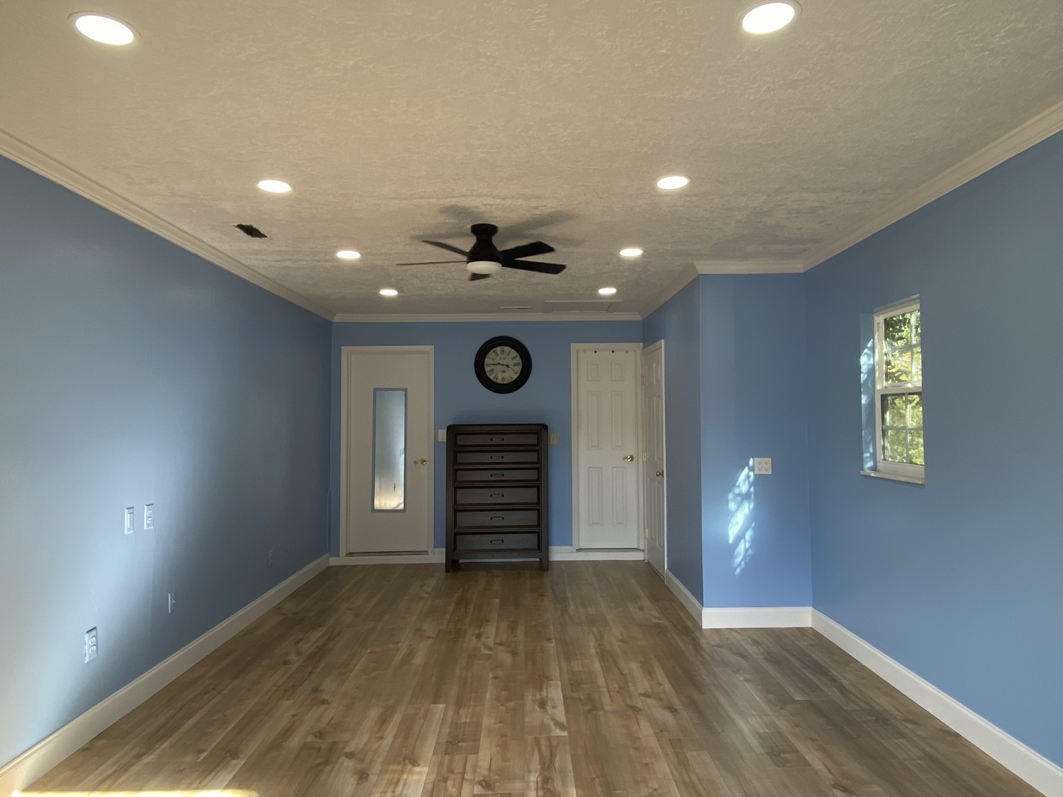 Residential renovation with flooring and lighting